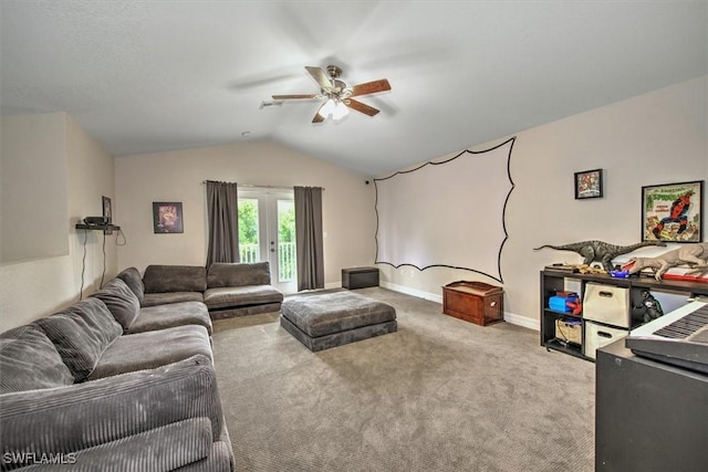 carpeted living room with ceiling fan and vaulted ceiling