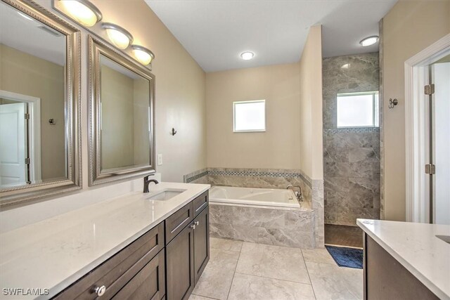 bathroom with vanity, separate shower and tub, and tile patterned floors