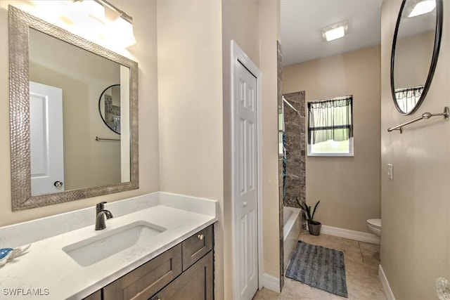 full bathroom featuring tile patterned floors, vanity, toilet, and tiled shower / bath