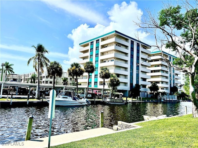 dock area featuring a yard and a water view