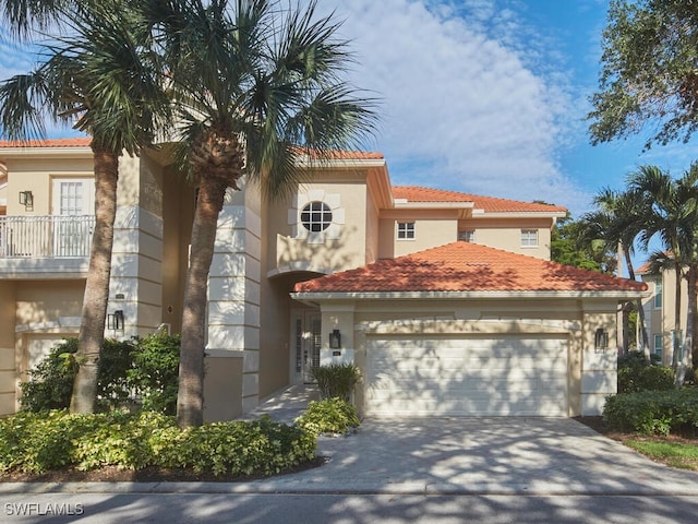 mediterranean / spanish house with a garage