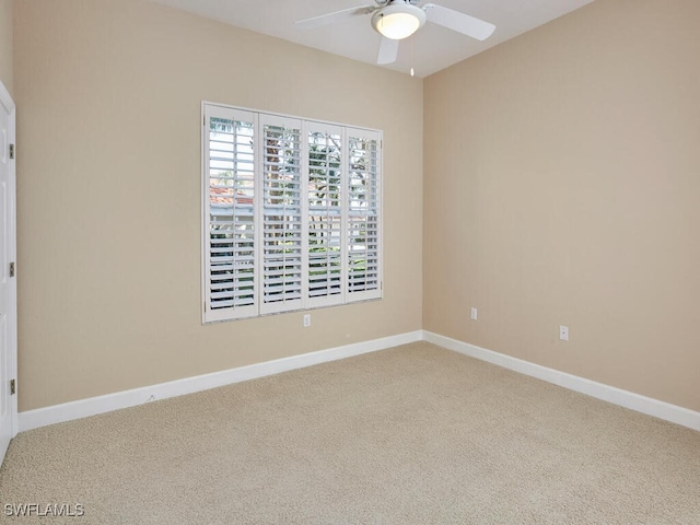 spare room with ceiling fan and carpet floors