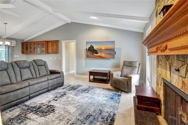 living room with lofted ceiling with beams, light tile patterned flooring, a notable chandelier, and a fireplace