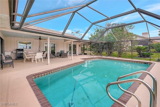 view of pool featuring ceiling fan, a lanai, and a patio area