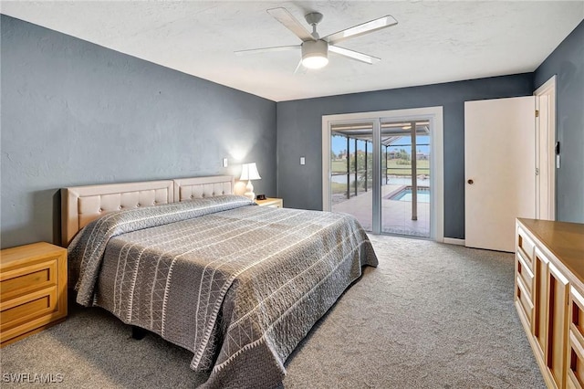 bedroom featuring access to exterior, a textured ceiling, ceiling fan, and carpet