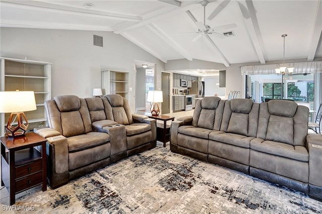 living room with ceiling fan with notable chandelier and lofted ceiling with beams