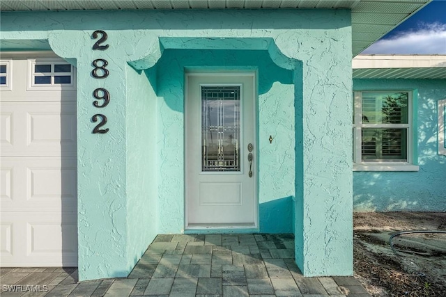 property entrance featuring a garage