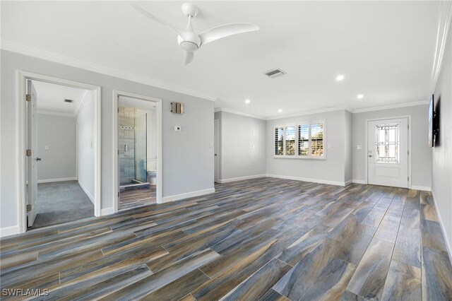 unfurnished living room featuring ceiling fan, ornamental molding, and dark hardwood / wood-style floors