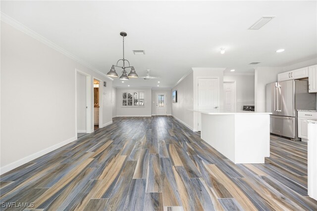 unfurnished living room featuring crown molding and dark hardwood / wood-style floors