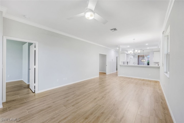 unfurnished living room with ornamental molding, light wood-type flooring, and ceiling fan with notable chandelier