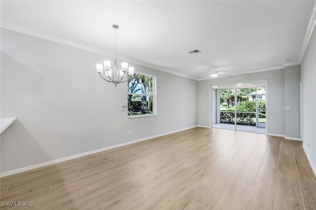 spare room with ornamental molding, light hardwood / wood-style floors, plenty of natural light, and ceiling fan with notable chandelier