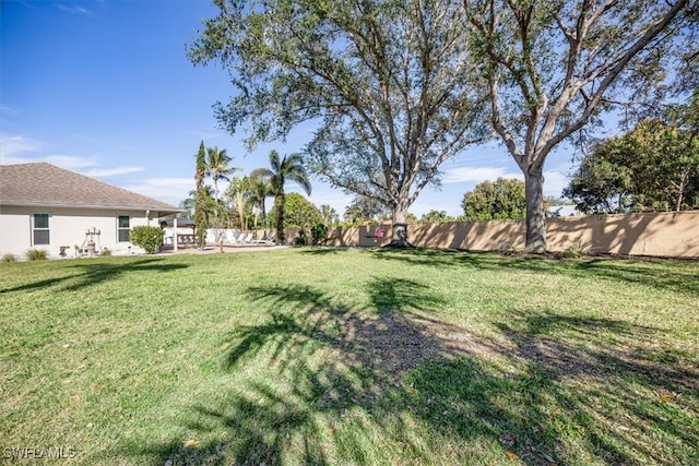 view of yard featuring fence