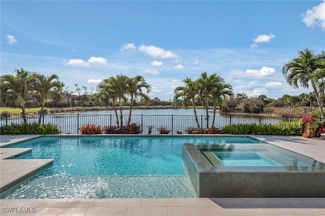 view of pool featuring an in ground hot tub and a water view