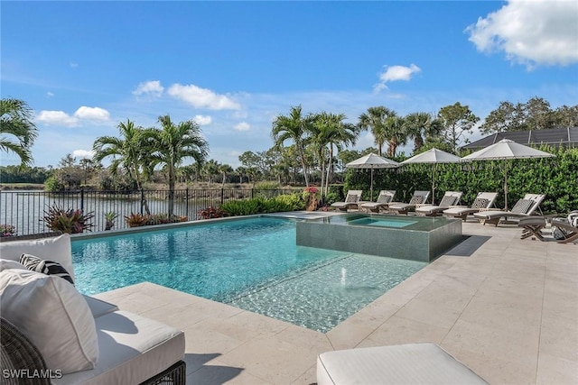 view of swimming pool with a water view, an in ground hot tub, and a patio