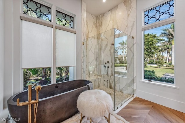 bathroom with parquet floors and independent shower and bath