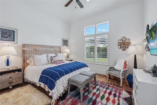 bedroom featuring hardwood / wood-style floors and ceiling fan