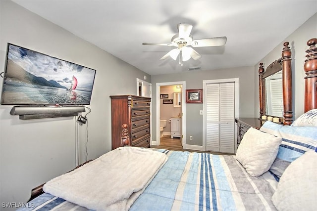 bedroom with a closet, ensuite bathroom, and ceiling fan