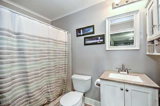 bathroom featuring curtained shower, toilet, vanity, and ornamental molding