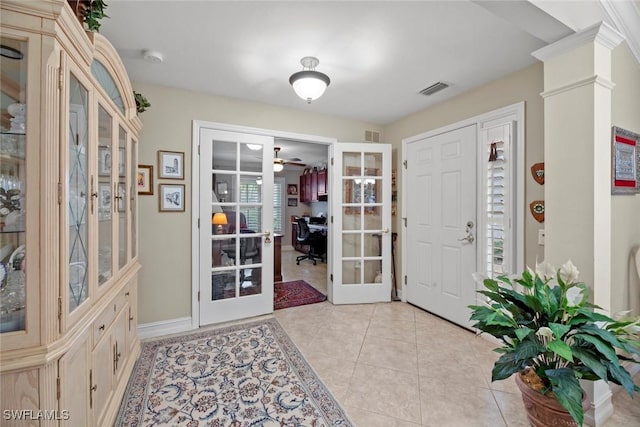 tiled foyer entrance with french doors