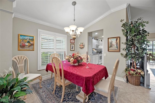 dining room with light tile patterned floors, an inviting chandelier, vaulted ceiling, and a wealth of natural light