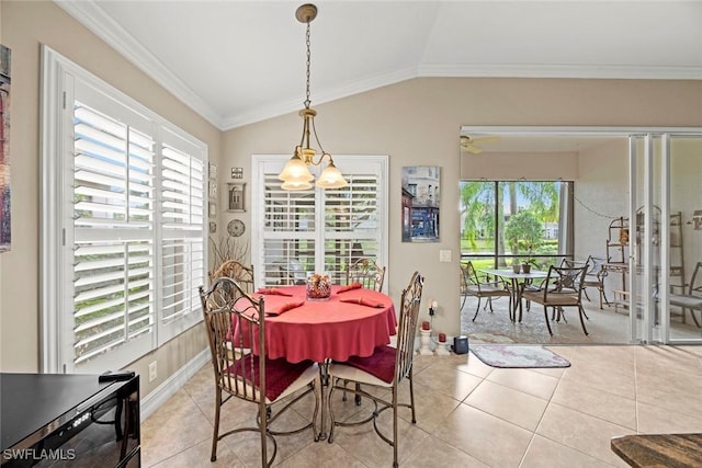 dining area featuring ornamental molding, ceiling fan with notable chandelier, light tile patterned floors, and lofted ceiling