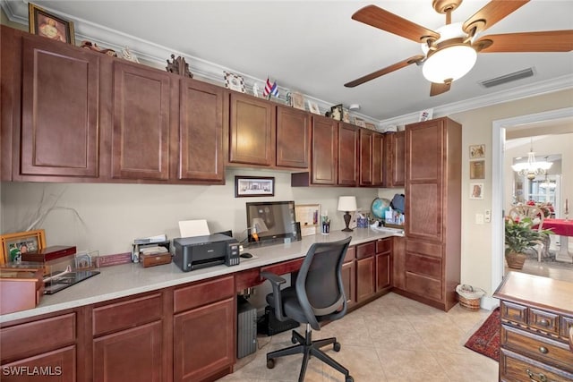 tiled home office with ceiling fan with notable chandelier, built in desk, and ornamental molding