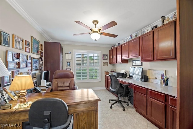 tiled home office with built in desk, ceiling fan, and crown molding