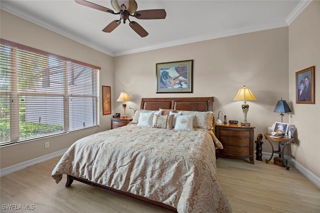 bedroom with ceiling fan, crown molding, and light hardwood / wood-style flooring