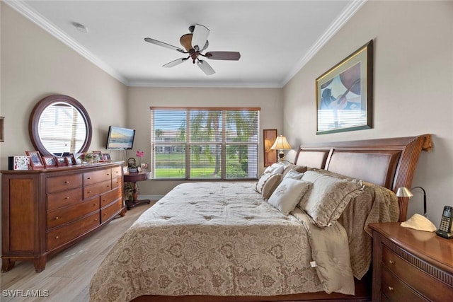 bedroom with light hardwood / wood-style floors, ceiling fan, and ornamental molding