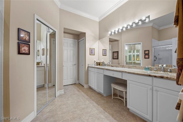 bathroom with tile patterned flooring, vanity, a shower with shower door, and ornamental molding