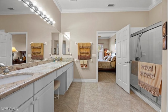 bathroom featuring tile patterned flooring, vanity, a shower with door, and ornamental molding