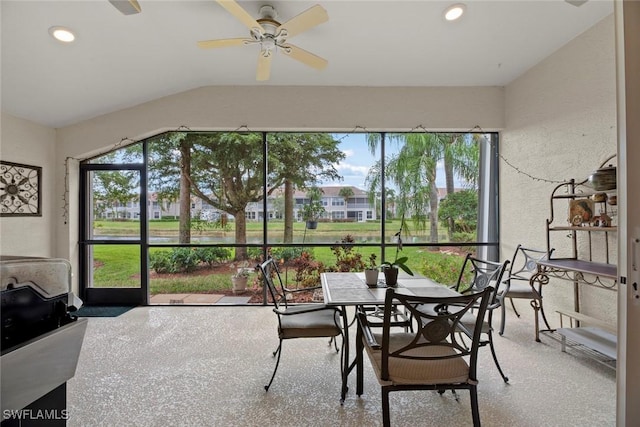 sunroom / solarium with ceiling fan and lofted ceiling