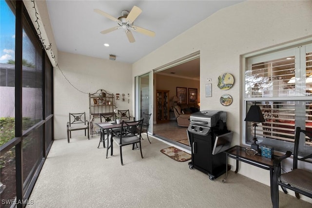 sunroom / solarium with ceiling fan