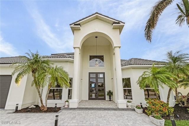 property entrance featuring french doors