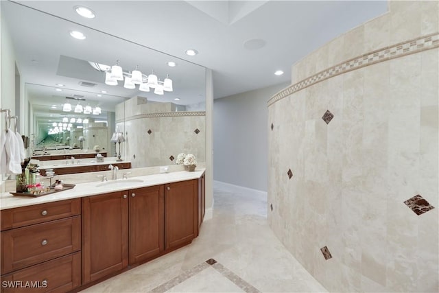 bathroom featuring vanity and a tile shower