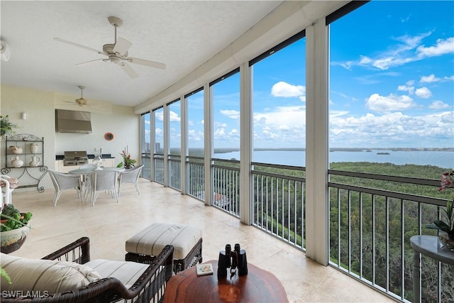 sunroom with a water view