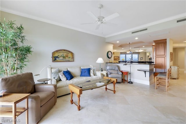 living room featuring crown molding and ceiling fan