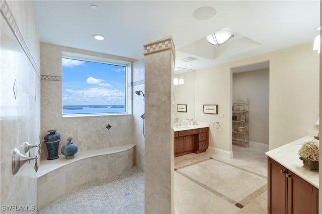 bathroom featuring vanity and a tile shower