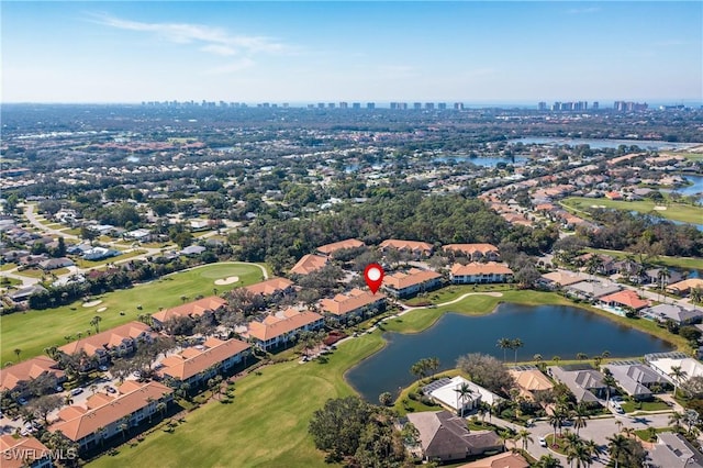 aerial view featuring view of golf course, a water view, a residential view, and a city view