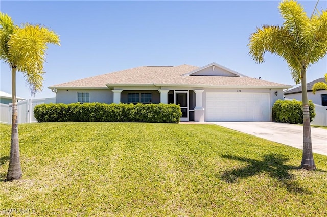 ranch-style house featuring a front lawn and a garage