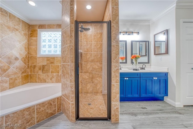 full bathroom with crown molding, double vanity, a sink, a shower stall, and a bath