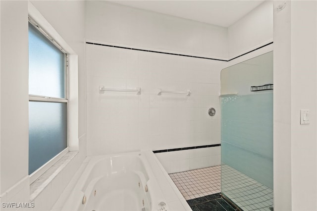 bathroom featuring separate shower and tub