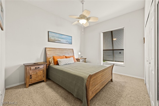 bedroom featuring light carpet and ceiling fan