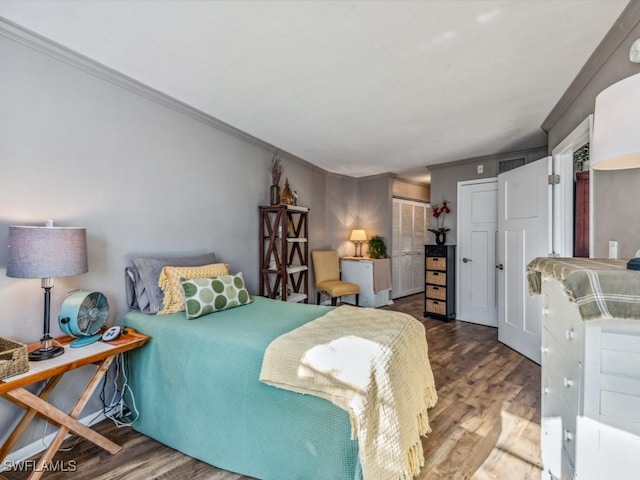 bedroom with a closet and wood-type flooring