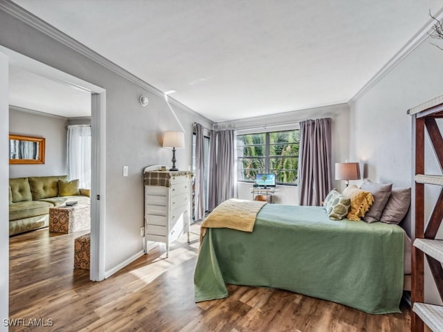 bedroom featuring wood-type flooring and ornamental molding