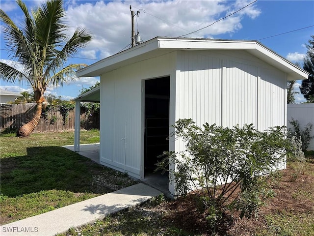 view of outdoor structure featuring a lawn