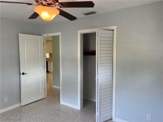 unfurnished bedroom with a closet and ceiling fan