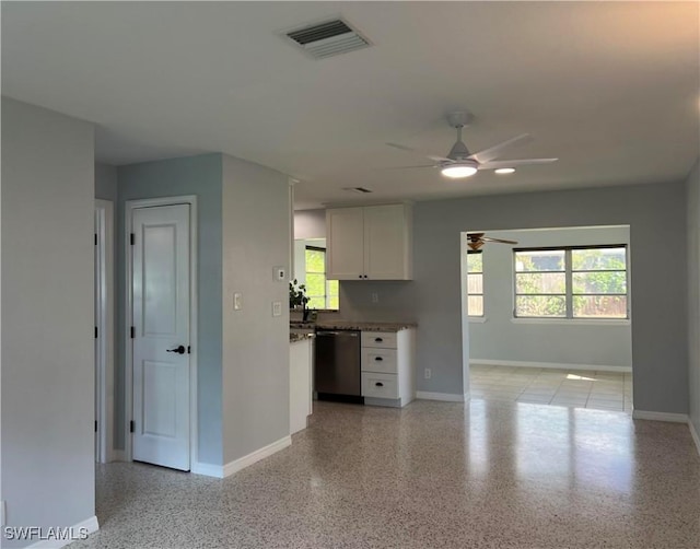 kitchen with ceiling fan, dishwasher, and white cabinets