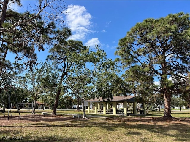 view of home's community with a yard