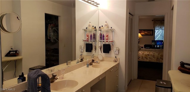 bathroom with tile patterned floors and vanity